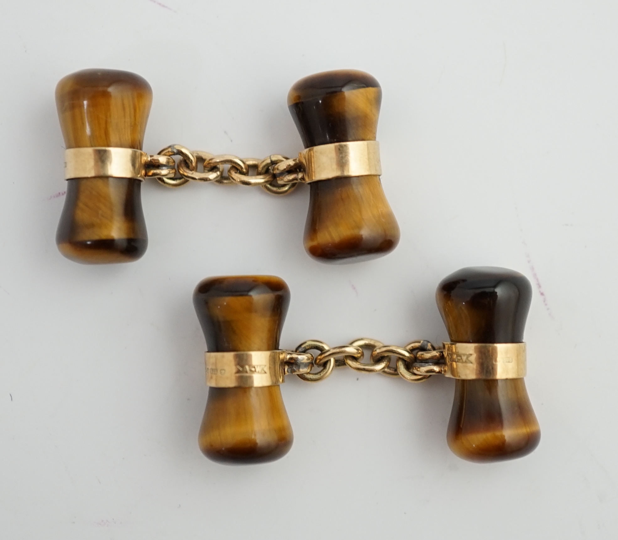 A pair 1970's 9ct gold and tigers eye quartz set dumbbell cufflinks